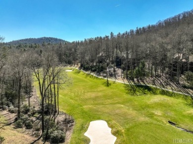 This 1 acre lot while gently sloping, overlooks the 17th green on Lake Toxaway Country Club in North Carolina - for sale on GolfHomes.com, golf home, golf lot