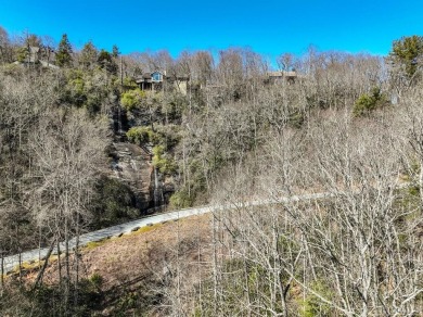 This 1 acre lot while gently sloping, overlooks the 17th green on Lake Toxaway Country Club in North Carolina - for sale on GolfHomes.com, golf home, golf lot