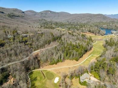 This 1 acre lot while gently sloping, overlooks the 17th green on Lake Toxaway Country Club in North Carolina - for sale on GolfHomes.com, golf home, golf lot