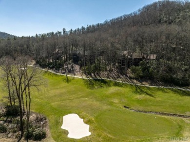 This 1 acre lot while gently sloping, overlooks the 17th green on Lake Toxaway Country Club in North Carolina - for sale on GolfHomes.com, golf home, golf lot