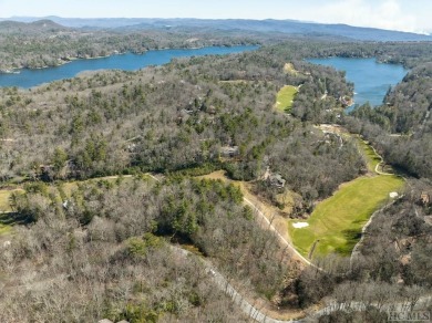 This 1 acre lot while gently sloping, overlooks the 17th green on Lake Toxaway Country Club in North Carolina - for sale on GolfHomes.com, golf home, golf lot