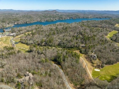 This 1 acre lot while gently sloping, overlooks the 17th green on Lake Toxaway Country Club in North Carolina - for sale on GolfHomes.com, golf home, golf lot