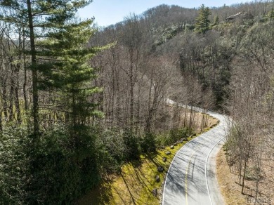 This 1 acre lot while gently sloping, overlooks the 17th green on Lake Toxaway Country Club in North Carolina - for sale on GolfHomes.com, golf home, golf lot