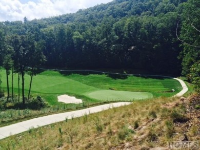 This 1 acre lot while gently sloping, overlooks the 17th green on Lake Toxaway Country Club in North Carolina - for sale on GolfHomes.com, golf home, golf lot