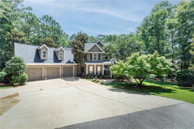 This Grove Hill home sits on a private lot with beautiful trees on Moores Mill Golf Club in Alabama - for sale on GolfHomes.com, golf home, golf lot