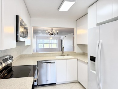 Beautifully renovated spacious 2-bedroom, 2-bath first-floor on Fountains Golf and Country Club in Florida - for sale on GolfHomes.com, golf home, golf lot