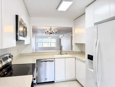 Beautifully updated spacious 2-bedroom, 2-bath first-floor condo on Fountains Golf and Country Club in Florida - for sale on GolfHomes.com, golf home, golf lot