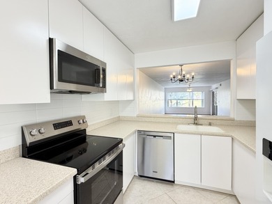 Beautifully updated spacious 2-bedroom, 2-bath first-floor condo on Fountains Golf and Country Club in Florida - for sale on GolfHomes.com, golf home, golf lot