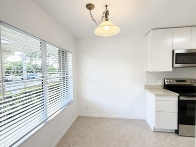 Beautifully renovated spacious 2-bedroom, 2-bath first-floor on Fountains Golf and Country Club in Florida - for sale on GolfHomes.com, golf home, golf lot