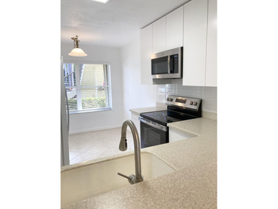 Beautifully updated spacious 2-bedroom, 2-bath first-floor condo on Fountains Golf and Country Club in Florida - for sale on GolfHomes.com, golf home, golf lot