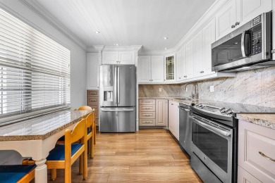 Spacious 3-Bedroom Condo with Stunning Lake, Garden, and Golf on Palm-Aire Country Club and Resort - The Oaks in Florida - for sale on GolfHomes.com, golf home, golf lot