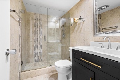 Spacious 3-Bedroom Condo with Stunning Lake, Garden, and Golf on Palm-Aire Country Club and Resort - The Oaks in Florida - for sale on GolfHomes.com, golf home, golf lot