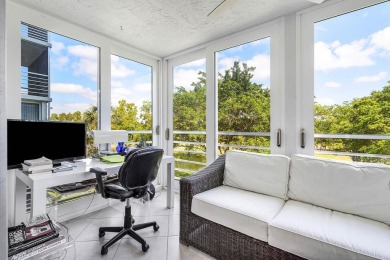 Spacious 3-Bedroom Condo with Stunning Lake, Garden, and Golf on Palm-Aire Country Club and Resort - The Oaks in Florida - for sale on GolfHomes.com, golf home, golf lot