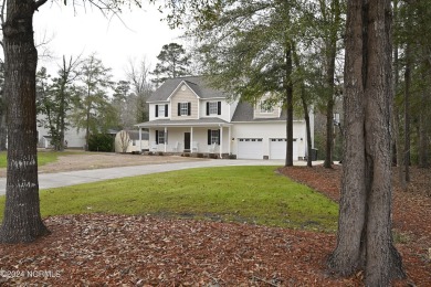 Welcome to this charming two-story residence nestled on a on Compass Pointe Golf Course in North Carolina - for sale on GolfHomes.com, golf home, golf lot