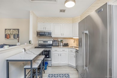 Enjoy low maintenance living in this bright and updated one on Leisure Village Golf Course in New York - for sale on GolfHomes.com, golf home, golf lot