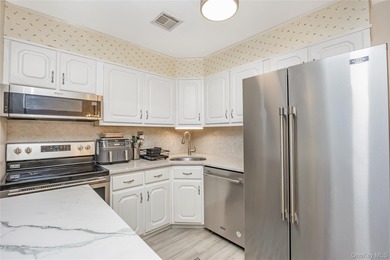 Enjoy low maintenance living in this bright and updated one on Leisure Village Golf Course in New York - for sale on GolfHomes.com, golf home, golf lot