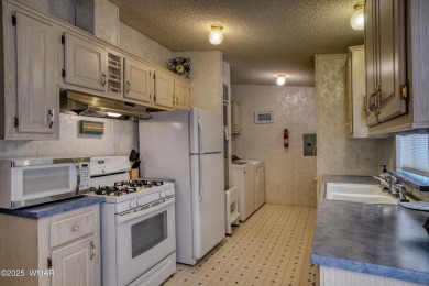 Discover your perfect mountain escape in this immaculate and on Pinetop Lakes Golf and Country Club in Arizona - for sale on GolfHomes.com, golf home, golf lot