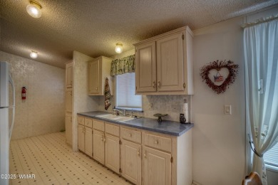 Discover your perfect mountain escape in this immaculate and on Pinetop Lakes Golf and Country Club in Arizona - for sale on GolfHomes.com, golf home, golf lot