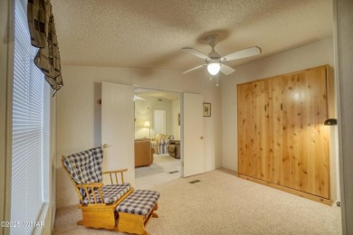 Discover your perfect mountain escape in this immaculate and on Pinetop Lakes Golf and Country Club in Arizona - for sale on GolfHomes.com, golf home, golf lot