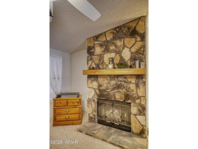 Discover your perfect mountain escape in this immaculate and on Pinetop Lakes Golf and Country Club in Arizona - for sale on GolfHomes.com, golf home, golf lot
