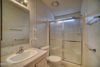 Discover your perfect mountain escape in this immaculate and on Pinetop Lakes Golf and Country Club in Arizona - for sale on GolfHomes.com, golf home, golf lot