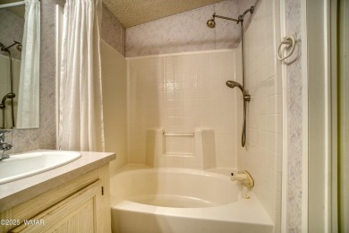 Discover your perfect mountain escape in this immaculate and on Pinetop Lakes Golf and Country Club in Arizona - for sale on GolfHomes.com, golf home, golf lot