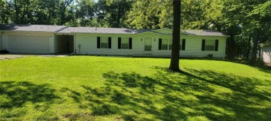 Love the peaceful lakeside living and exciting recreational on Linn Valley Lakes - Deer Trace Golf Course in Kansas - for sale on GolfHomes.com, golf home, golf lot