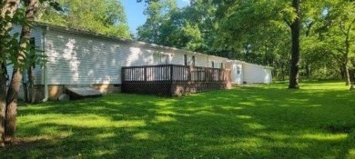 Love the peaceful lakeside living and exciting recreational on Linn Valley Lakes - Deer Trace Golf Course in Kansas - for sale on GolfHomes.com, golf home, golf lot