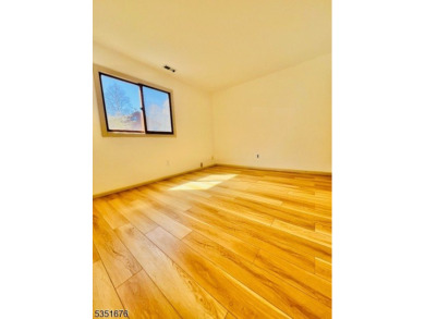 Step into this freshly renovated 2-bed, 2-bath end-unit on a on Minerals Golf Club in New Jersey - for sale on GolfHomes.com, golf home, golf lot