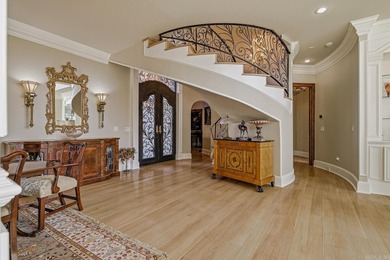 Luxury home with striking European architecture overlooking the on RidgePointe Country Club in Arkansas - for sale on GolfHomes.com, golf home, golf lot