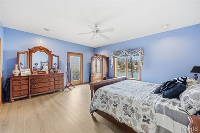 Lake life is calling--and this one answers in style! This on Raintree Country Club in Missouri - for sale on GolfHomes.com, golf home, golf lot