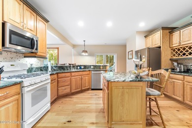 This beautifully maintained brick ranch is ready for its next on Sound Golf Links at Albemarle Plantation in North Carolina - for sale on GolfHomes.com, golf home, golf lot