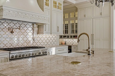 Luxury home with striking European architecture overlooking the on RidgePointe Country Club in Arkansas - for sale on GolfHomes.com, golf home, golf lot