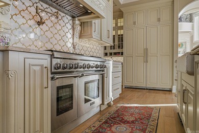 Luxury home with striking European architecture overlooking the on RidgePointe Country Club in Arkansas - for sale on GolfHomes.com, golf home, golf lot