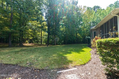 This beautifully maintained brick ranch is ready for its next on Sound Golf Links at Albemarle Plantation in North Carolina - for sale on GolfHomes.com, golf home, golf lot