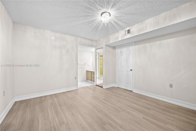 GREAT 2 BEDROOM 2 BATH WHITEHALL CONDO LOCATED IN THE PRIVATE on Pine Island Ridge Country Club in Florida - for sale on GolfHomes.com, golf home, golf lot