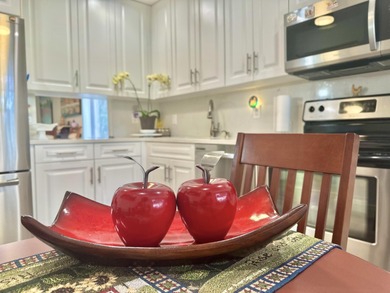 Beautifully renovated corner residence located in the highly on Boca Lago Golf and Country Club in Florida - for sale on GolfHomes.com, golf home, golf lot