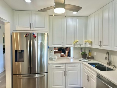 Beautifully renovated corner residence located in the highly on Boca Lago Golf and Country Club in Florida - for sale on GolfHomes.com, golf home, golf lot