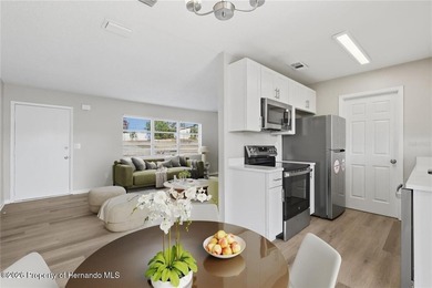 Move right into this thoughtfully updated 2 bedroom, 1.5 on Oak Hills Country Club in Florida - for sale on GolfHomes.com, golf home, golf lot