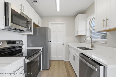 Move right into this thoughtfully updated 2 bedroom, 1.5 on Oak Hills Country Club in Florida - for sale on GolfHomes.com, golf home, golf lot