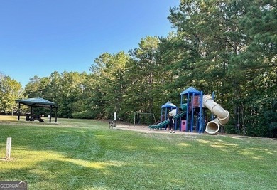 Terrific home in one of Peachtree City's most desired areas on Canongate At Flat Creek Club in Georgia - for sale on GolfHomes.com, golf home, golf lot