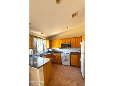 Welcome to this charming 3-bedroom, 2-bathroom home on a on Arizona City Golf Club in Arizona - for sale on GolfHomes.com, golf home, golf lot