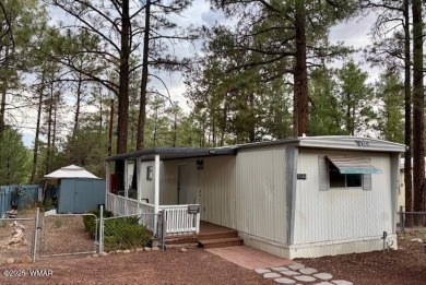 Check out this 2 bedroom, 1 bath home nestled in the tall pines on Bison Golf and Country Club in Arizona - for sale on GolfHomes.com, golf home, golf lot