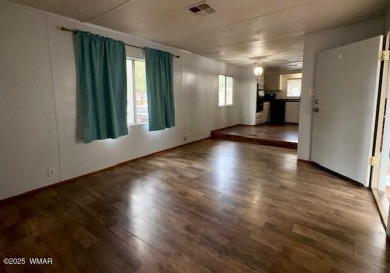 Check out this 2 bedroom, 1 bath home nestled in the tall pines on Bison Golf and Country Club in Arizona - for sale on GolfHomes.com, golf home, golf lot
