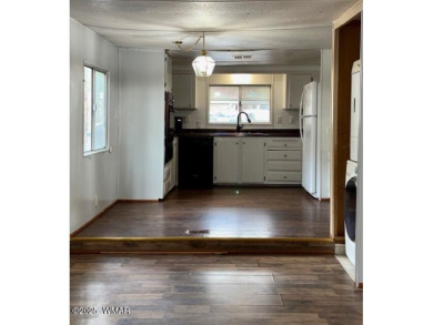 Check out this 2 bedroom, 1 bath home nestled in the tall pines on Bison Golf and Country Club in Arizona - for sale on GolfHomes.com, golf home, golf lot