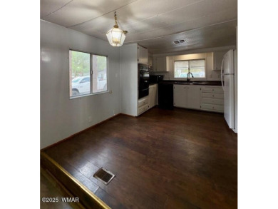 Check out this 2 bedroom, 1 bath home nestled in the tall pines on Bison Golf and Country Club in Arizona - for sale on GolfHomes.com, golf home, golf lot