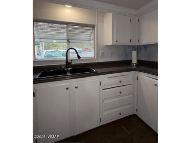 Check out this 2 bedroom, 1 bath home nestled in the tall pines on Bison Golf and Country Club in Arizona - for sale on GolfHomes.com, golf home, golf lot