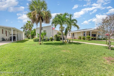 Welcome to your slice of paradise in Barefoot Bay! This charming on Barefoot Bay Golf Course in Florida - for sale on GolfHomes.com, golf home, golf lot