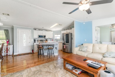 Welcome to your slice of paradise in Barefoot Bay! This charming on Barefoot Bay Golf Course in Florida - for sale on GolfHomes.com, golf home, golf lot
