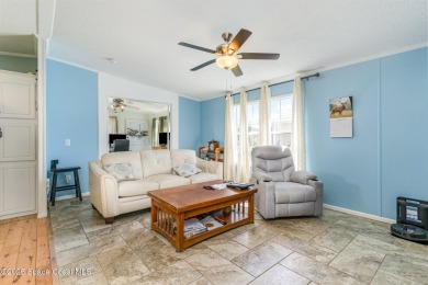 Welcome to your slice of paradise in Barefoot Bay! This charming on Barefoot Bay Golf Course in Florida - for sale on GolfHomes.com, golf home, golf lot